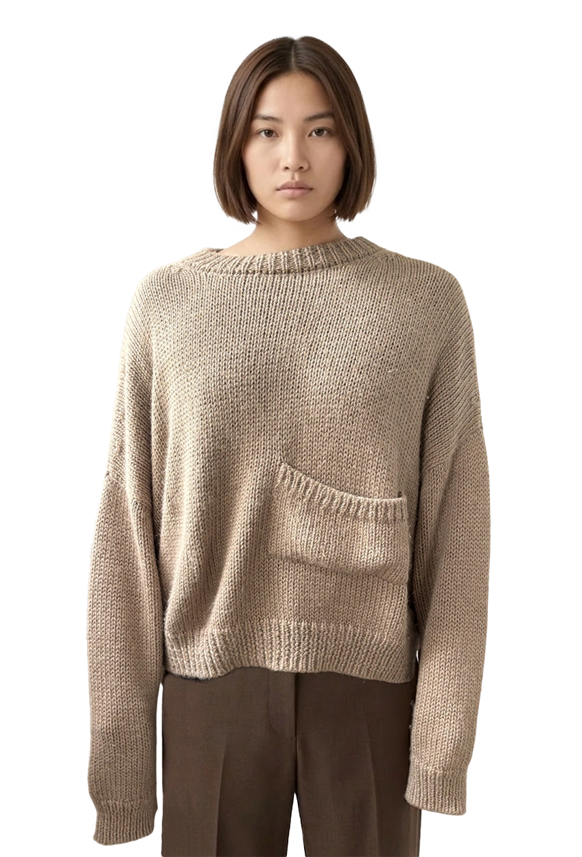 A model wearing the beige soft sweater against a neutral background.
