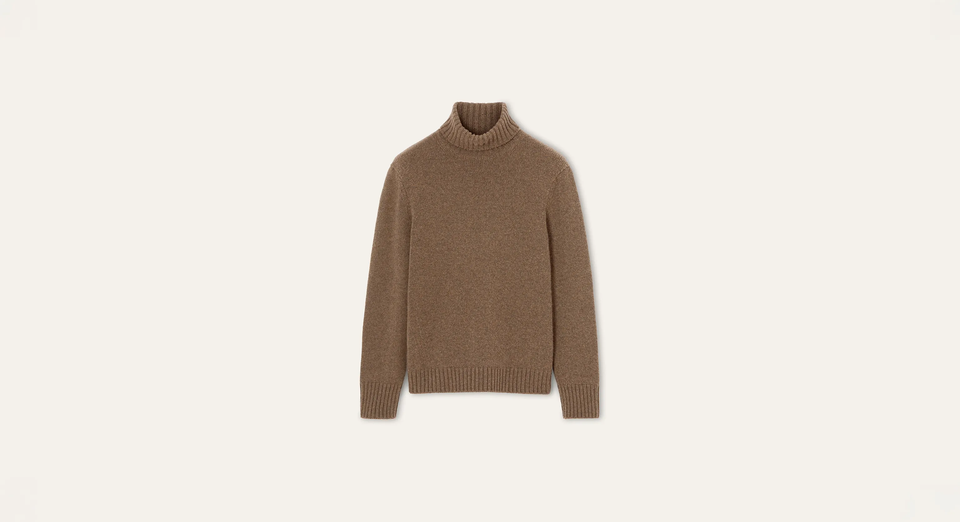 A brown ribbed turtleneck sweater on a neutral background.